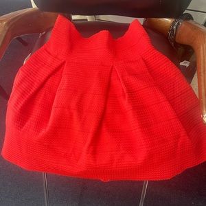 Short circle skirt with  shaped waist  it’s bright red/orange color